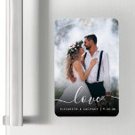 Custom Wedding Photo Love White Script Magnet<br><div class="desc">Celebrate your wedding with this keepsake flexible magnet, featuring the word "love" in elegant white handwriting script with swashes at the beginning and end. Personalize it with your names and wedding date, and replace the sample image with your favourite wedding photo. A black gradient filter helps make the text pop....</div>