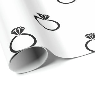 Customizable Black Engagement Rings on White Wrapping Paper