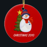 Customizable Snowman and Christmas Tree Ceramic Ornament<br><div class="desc">Snowman and Christmas Tree Ornament on a red background.</div>