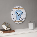 Customizable Soccer Shirt  Sky Blue and White Large Clock<br><div class="desc">Sky blue and white soccer jersey with soccer ball hanging in a changing room. This design is fully customizable with your own name and number. Great gift for any soccer player, soccer girl, soccer mom or soccer fan. We can make this product in any jersey colour combination just contact us...</div>