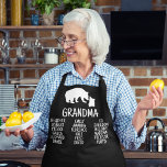 Customized Gift With Grandkid's Names Grandma Bear Apron<br><div class="desc">This personalized apron is perfect for grandma. It features a black rustic bear on a white background and is made of 100% polyester. The apron is designed to protect your clothes while you are cooking or baking. It is also great for everyday use around the house. The apron is personalized...</div>