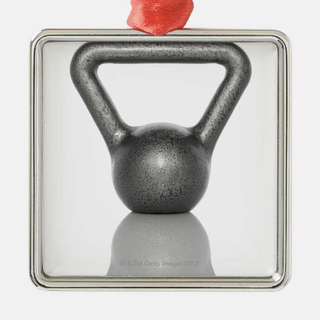 Cut out of a kettle bell on white background metal ornament (Front)