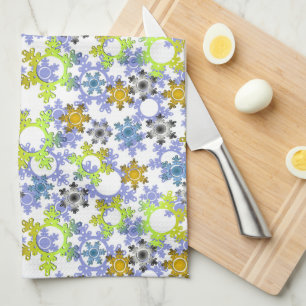 Cut paper snowflakes multicolored on white kitchen towel