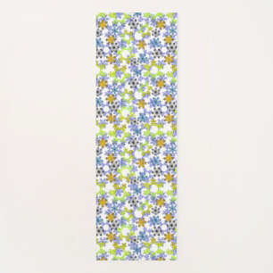 Cut paper snowflakes multicolored on white yoga mat