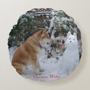 cute akita sitting with snowman snow dog photo round pillow