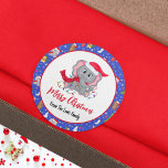 Cute Baby Elephant With Zoo Merry Christmas  Classic Round Sticker<br><div class="desc">This charming design features a cute baby elephant adorned with Christmas lights, set against a backdrop of playful holiday elements. The design includes a variety of beloved animals in festive attire, accented with snowflakes and star trim. Personalize it with your family name for a special touch that adds warmth and...</div>