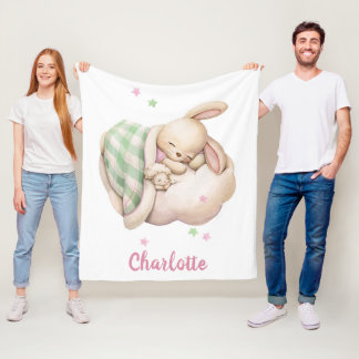 Cute baby girl bunny sleeping on a cloud fleece blanket