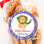 Cute Baby Lion With Zoo Merry Christmas  Classic Round Sticker<br><div class="desc">This charming design features a cute baby lion holding candy canes. The design includes a variety of beloved animals in festive attire,  accented with snowflakes and star trim. Personalize it with your family name for a special touch that adds warmth and joy to the holiday season.</div>