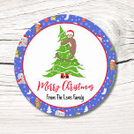 Cute Baby Monkey With Zoo Merry Christmas  Classic Round Sticker<br><div class="desc">This charming design features a cute baby monkey climbing a Christmas tree. The design includes a variety of beloved animals in festive attire,  accented with snowflakes and star trim. Personalize it with your family name for a special touch that adds warmth and joy to the holiday season.</div>