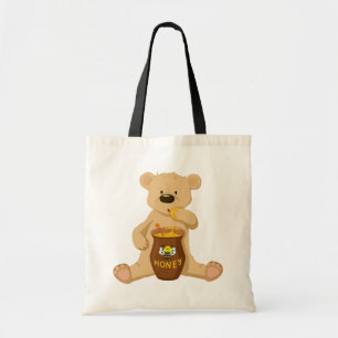 Cute bear eating honey tote bag