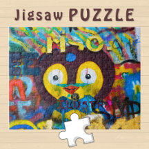 Cute Bird Face on the Graffiti Wall Photo - 