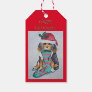 cute black and brown puppy with christmas stocking gift tags