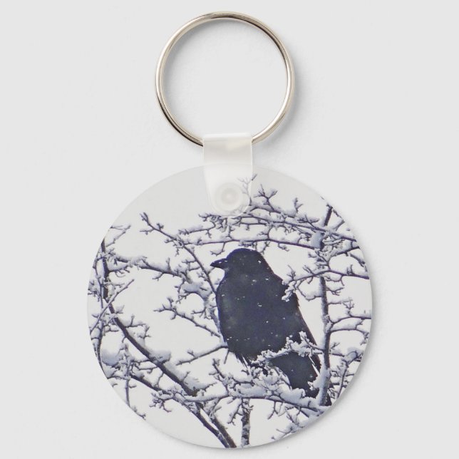 Cute black bird in snowy branches keychain (Front)