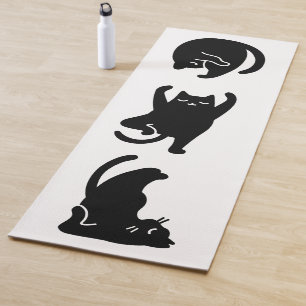 Cute black cat doing yoga,  yoga mat