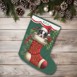 Cute Boston Terrier Puppy Peeking Large Christmas Stocking<br><div class="desc">This Holiday stocking has an image of an adorable Boston Terrier puppy peeking out of an ornate red stocking. The image is surrounded by holly, red berries, and poinsettia blooms, and is placed on a Christmas green background. A white scalloped edge design bordered in red holds your customized name at...</div>