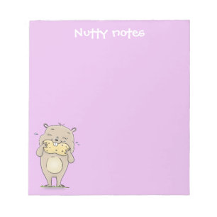 Cute brown hamster eating a peanut cartoon notepad