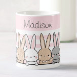 Cute Bunnies Personalized Coffee Mug<br><div class="desc">Enjoy your favourite beverages in style with this adorable custom name mug, featuring a charming row of cute bunnies set against a soft pink background. Perfect for kids and animal lovers alike, this high-quality mug can be personalized with any name, making it a unique and thoughtful gift. Whether for morning...</div>