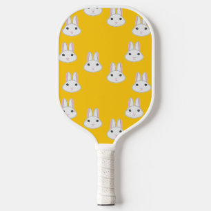 Cute bunny faces on orange pickleball paddle