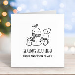 Cute Bunny Rabbit and Snowman Seasons Greetings  Rubber Stamp<br><div class="desc">Cute cartoon rabbit is adding a carrot nose to a snowman. The snowman is already sporting a lovely knitted scarf. A tiny bunny-shaped snowman and a bird complete the picture. Customizable text.</div>