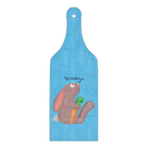 Cute bunny rabbit sitting with carrot cartoon cutting board