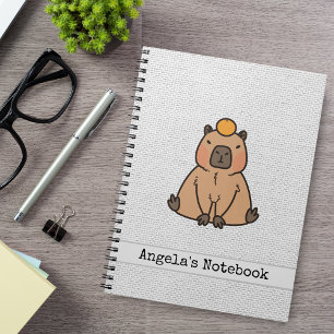 Cute Capybara with an Orange Notebook