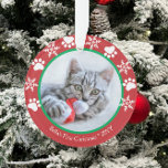 Cute Cat First Christmas Snowflakes Paw Prints Red Ornament<br><div class="desc">This pet cat design features space for a photo and text accented with paw prints and snowflakes on red and green. Perfect for cat lovers! Click the customize button for more flexibility in modifying/adding text and design elements! Variations of this design as well as coordinating products are available in our...</div>