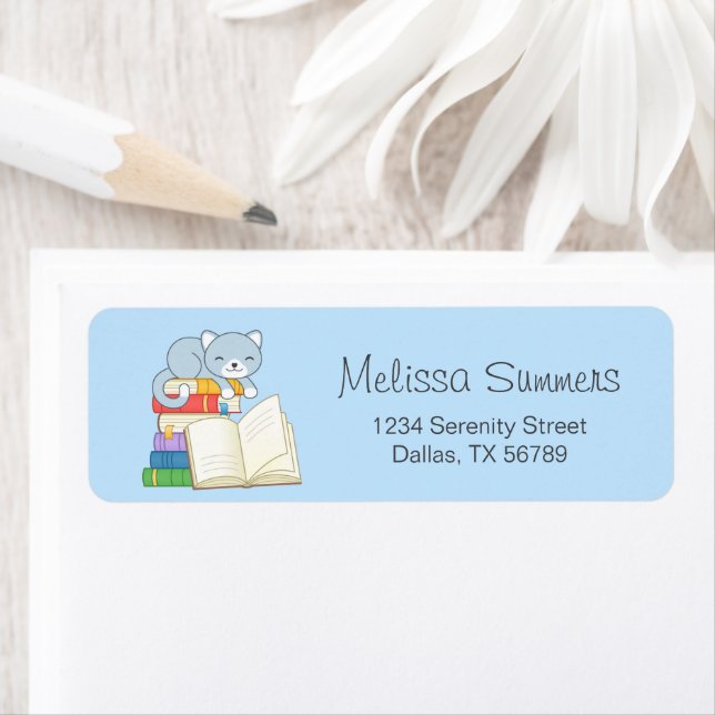 Cute Cat on top of a Book Stack on Blue (Insitu)