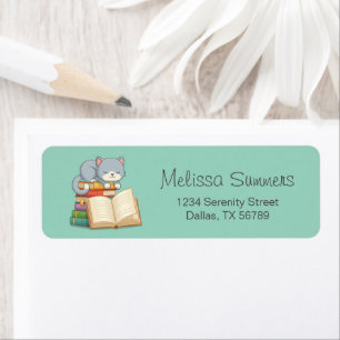 Cute Cat on top of a Book Stack on Green