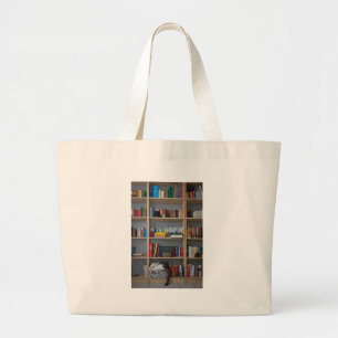 Cute cat sleeping on bookshelf library books large tote bag