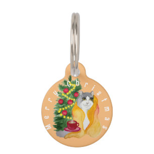 Cute cat under a cozy blanket with a cup of tea pet tag