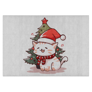Cute cat wearing Santa hat near Christmas tree Cutting Board