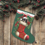 Cute Chihuahua Puppy Peeking Large Christmas Stocking<br><div class="desc">This Holiday stocking has an image of an adorable black and tan Chihuahua puppy peeking out of an ornate red stocking. The image is surrounded by holly, red berries, and poinsettia blooms, and is placed on a Christmas green background. A white scalloped edge design bordered in red holds your customized...</div>