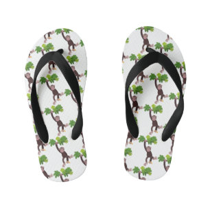 Cute chimpanzee in jungle hanging cartoon kid's flip flops