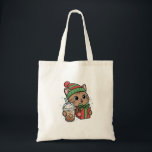 Cute Christmas Cat Tote Bag<br><div class="desc">This cute kawaii Christmas cat tote bag features an adorable festive kitty wearing a winter hat and holding a holiday gift and iced coffee. The playful illustration makes this bag perfect for cat lovers,  coffee fans,  and anyone who enjoys cozy winter aesthetics.</div>
