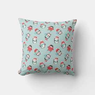 Cute christmas penguins on light blue throw pillow