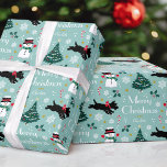 Cute Christmas Scottie Dog Snowman Teal Editable Wrapping Paper<br><div class="desc">Add a little whimsical charm to the holiday season with this cute Christmas gift wrap! An editable template, personalized with your family or the recipient's name. This seamless pattern features original artwork of a Scottie dog wearing a red bow, as he dashes along in the snow! There's a happy snowman...</div>