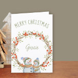 Cute Christmas Snowmen Winter Berry Wreath Holiday Card<br><div class="desc">Personalized Christmas Card with winter berry wreath and cute snowman. The template is set up for you to add a name to the front of the card and you can also edit the message inside. The wording on the front simply reads "Merry Christmas [name]" and the design is decorated with...</div>