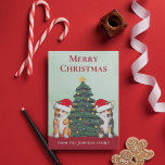 Cute Corgi Christmas Tree Dog in Santa Hat Custom Holiday Card<br><div class="desc">These beautiful Pembroke Welsh Corgi dogs have their heads tilted inside of a cute Santa Claus hat. The two pups are sitting in front of a pretty Christmas tree decorated with colourful ornaments. A lovely corgis holiday card with a wonderful drawing of a tricolor and a red and white corgi...</div>