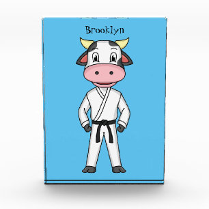 Cute cow in kung fu suit cartoon  photo block