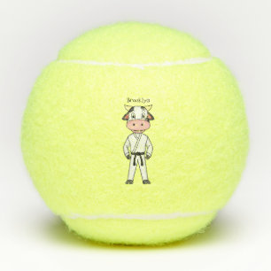 Cute cow in kung fu suit cartoon tennis balls