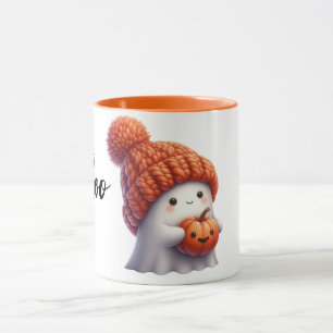 Cute Cozy Ghost in Knitted Hat Holding Pumpkin Mug