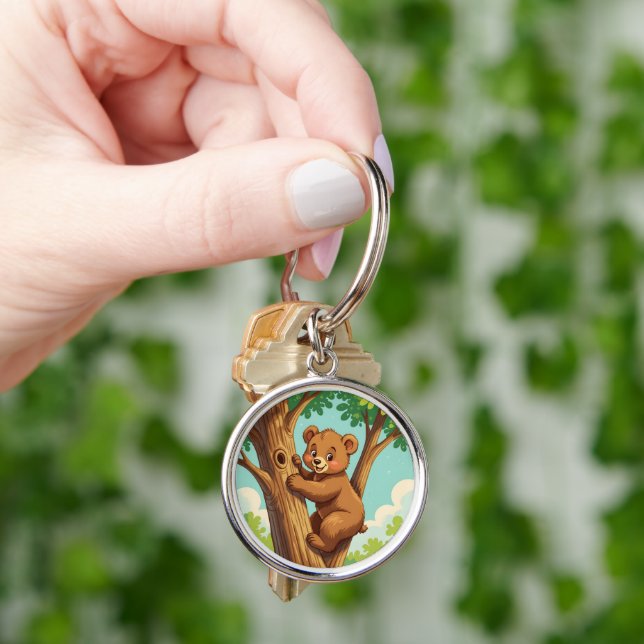 Cute cub bear climbing a tree keychain (Hand)