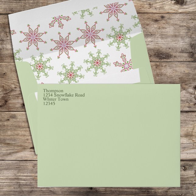 Cute Custom Snowflake Holiday Green 5x7 Envelope (Red and Green Holiday snowflake pattern envelope with return address on the front. )