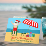 Cute Custom Sunny Beach Santa Claus Christmas Holiday Card<br><div class="desc">This cute custom sunny Christmas card makes the perfect postcard for warm weather at the pool or beach. Make it a fun north pole themed extravaganza with Santa Claus in his swimming trunks next to a red and white striped beach umbrella and gifts. I've never seen Mr. Klaus in a...</div>