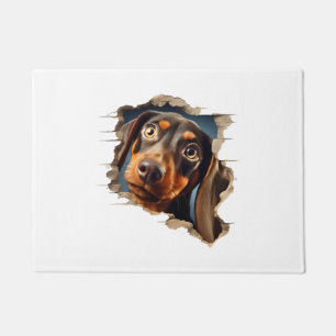 Cute dachshund puppy peeking in doormat