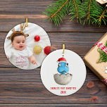 Cute Dinosaur Baby's First Christmas Photo  Ceramic Ornament<br><div class="desc">On this cute Christmas Dinosaur design you will find a lovely little newborn dinosaur in an eggshell with a Santa hat on the head. You can add a name and the year of the baby's first Christmas. On the back you can add your own photo. This design is perfect for...</div>