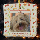 Cute Dog First Christmas Personalized Ceramic Ornament<br><div class="desc">Your dog's photo,  personalized with a name and date,  surrounded by a fun pattern of dog treats.  Makes a great dog lover gift.</div>