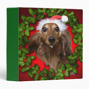 Cute dog with Santa's red hat and garland Binder