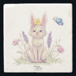 Cute Easter Cat with Chick Illustration Stone Coaster<br><div class="desc">Add a charming seasonal accent to your table with this stone coaster featuring a whimsical Easter cat illustration. The playful design shows a curious cat wearing bunny ears, with a tiny chick perched on its head and a butterfly fluttering nearby among delicate spring flowers. The scene captures the joyful spirit...</div>