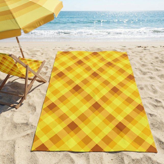 Cute Egg Yolk Yellow Plaid Beach Towel (Cute Egg Yolk Yellow Plaid Beach Towel on a sandy beach next a to chair and unbrella near an ocean.)